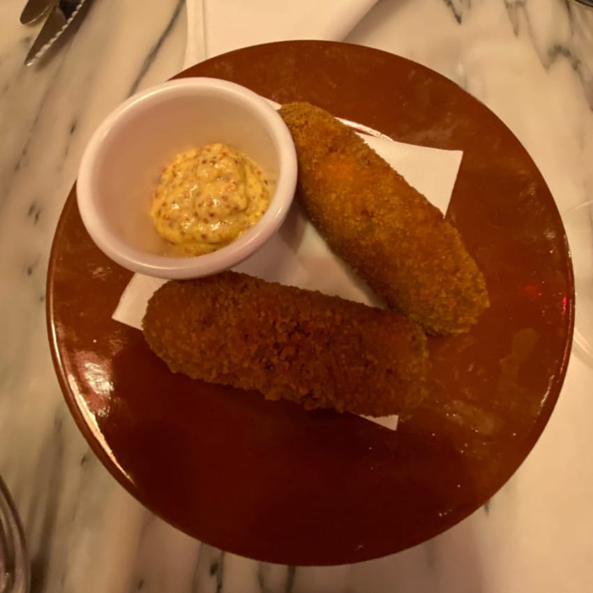 Thick and crispy beef croquettes with a mustard dipping sauce