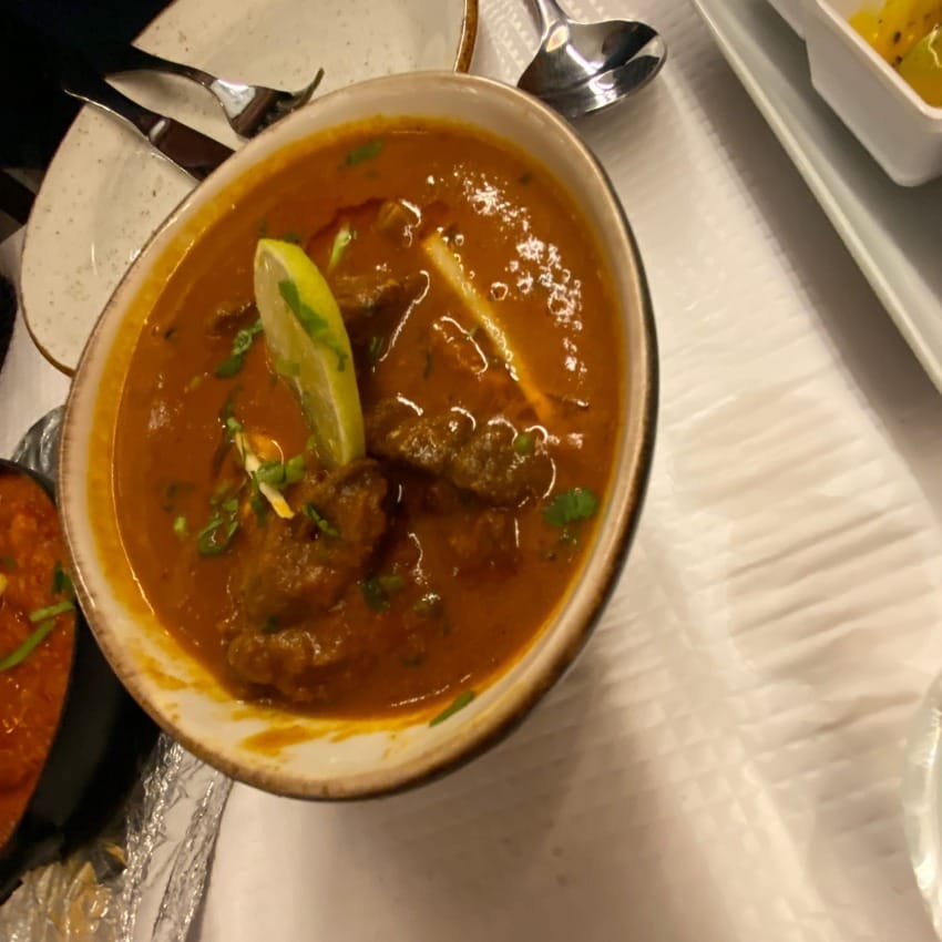 Spicy lamb karahi curry. Chunks of tender lamb in a rich tomato curry sauce