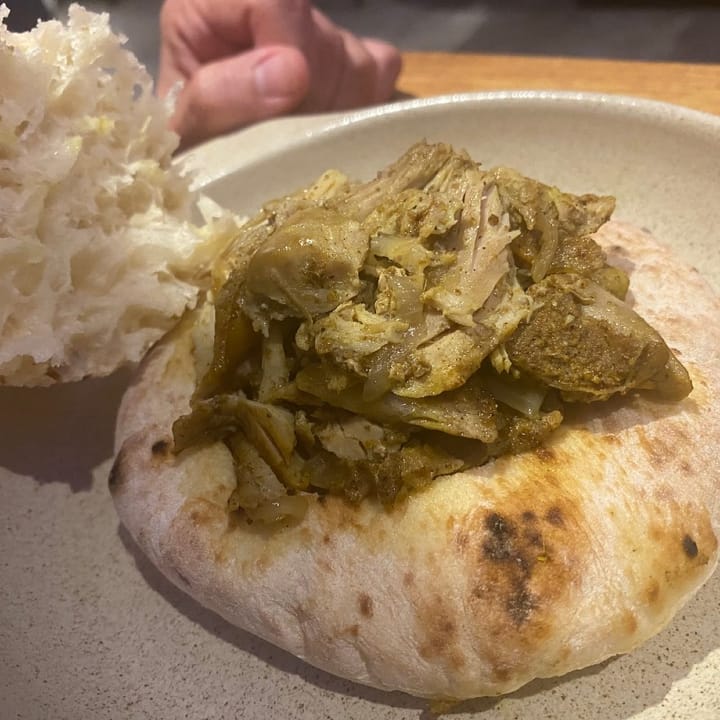 Round pita bread filled with Israeli turkey shawarma, seasoned and roasted to perfection