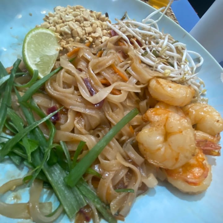 Prawn pad Thai topped with roasted peanuts and fresh lime