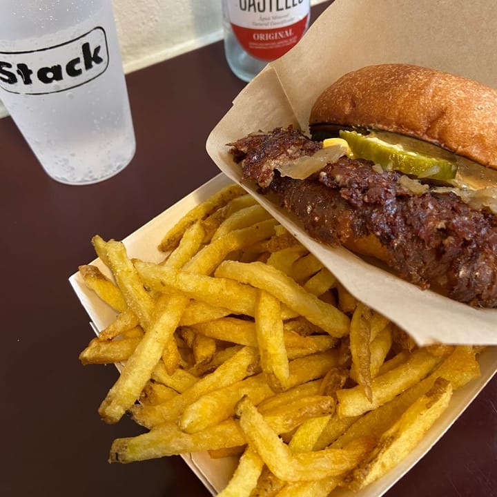 The Exit Smash Burger on fries and with sparkling water