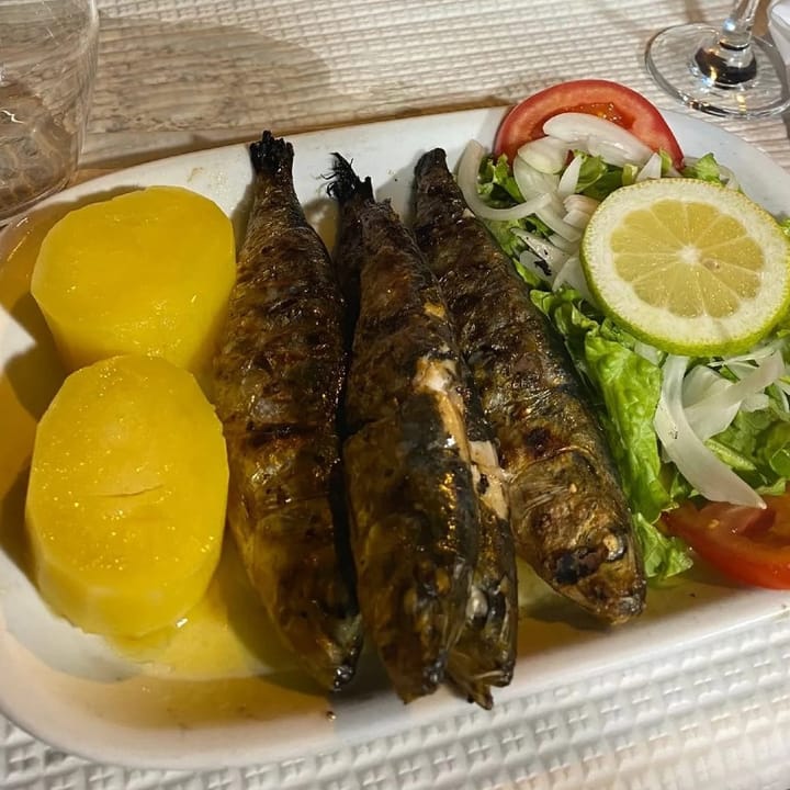 Freshly chargrilled sardines with potatoes and salad