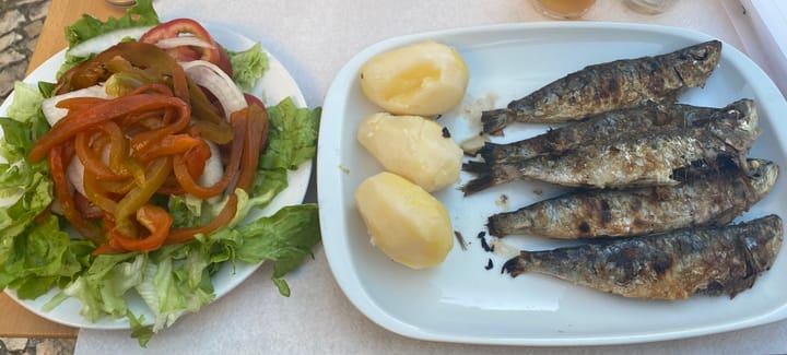 Freshly grilled sardines with potatoes and salad - THE Portuguese dish