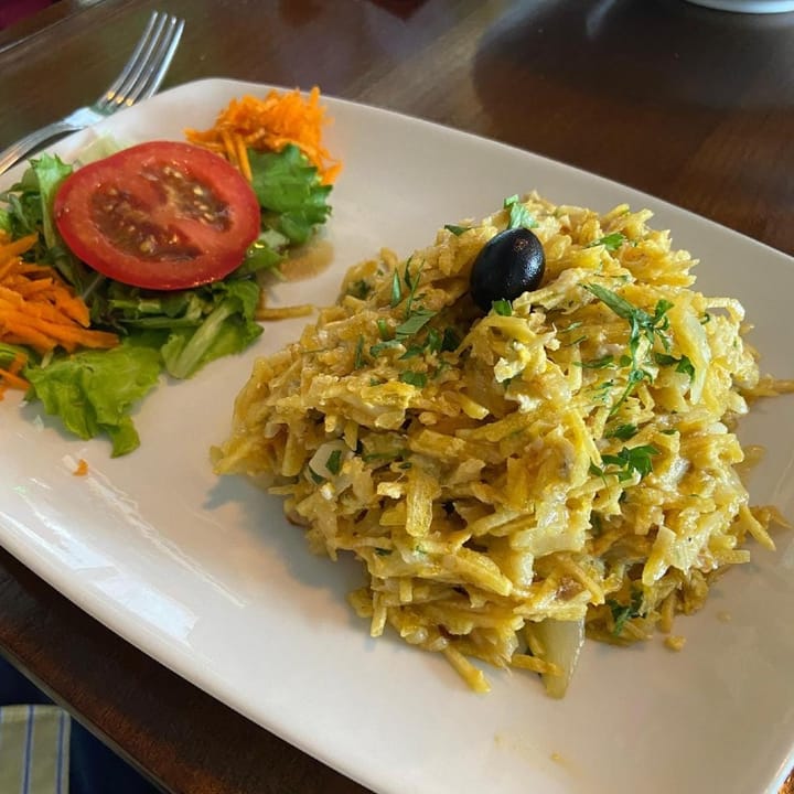 A fresh Bacalhau a Brás, shredded salted codfish and shredded potato and onions in egg
